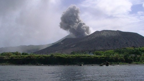 Tavurvur spurts ominously; ash hangs in the air