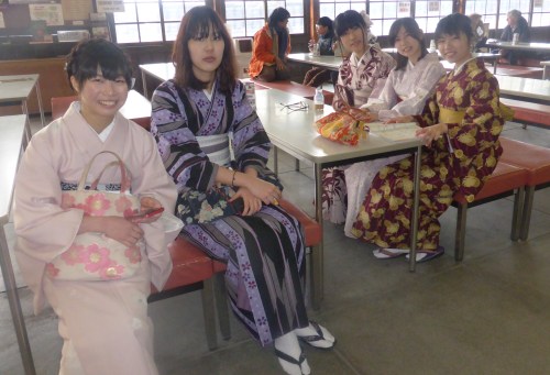 These young ladies visiting the Golden pagoda put down their mobiles for this picture