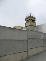 A remaining guard tower inside the concrete walls
