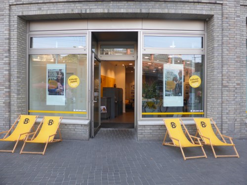 A bank agency where you can't withdraw money but you can sit in the deck chairs on the street.