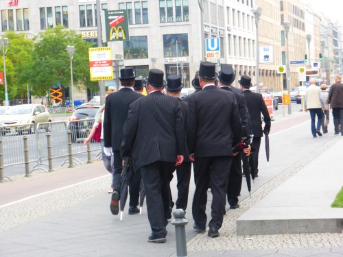 Out os the blue these dinner suited gents came strolling along at Potsdamer Platz in neat formation.