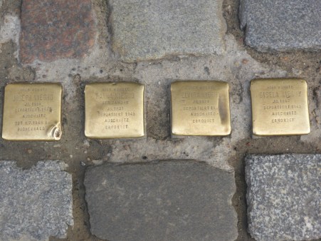 Bronze plaques in the cobble stones commemorating holocaust victims who lived nearby