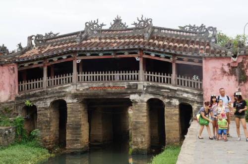 Note the family taking a selfie by the rebuilt Japanese Bridge